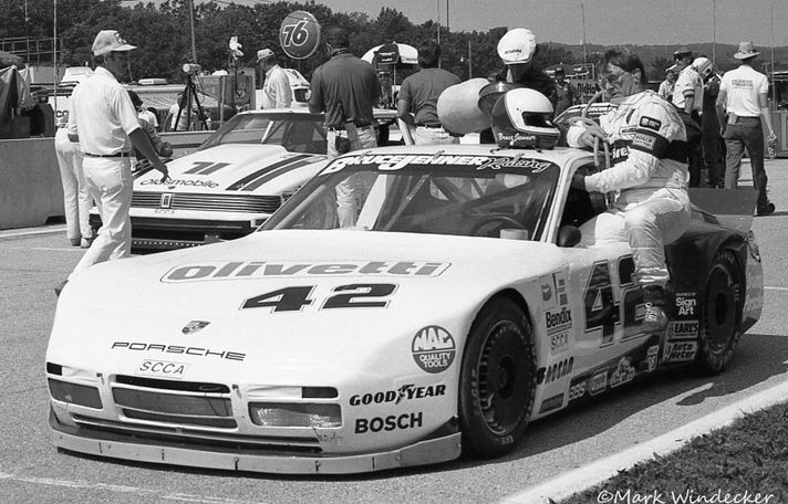 Bruce Jenner climbing into the #42 Porsche