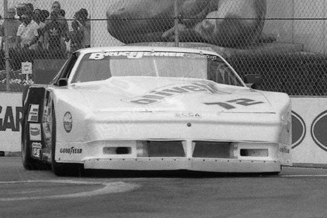 The #72 in 1987 livery on a street circuit, black and white