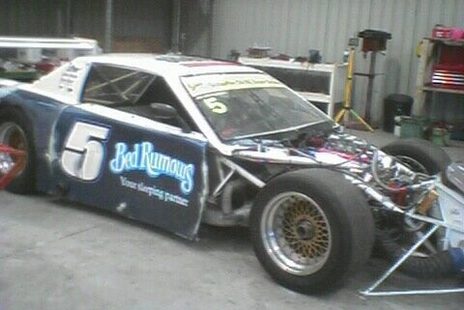The #5 Camaro with the nose off, Bed Rumours on the door and the V8 exposed
