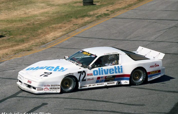 Chris Kneifel turning the #72 Olivetti / Rain-X Pontiac, his name above the door
