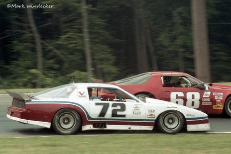 Bruce Jenner's striped #72 Pontiac alongside Craig Shafer's red #68 Camaro