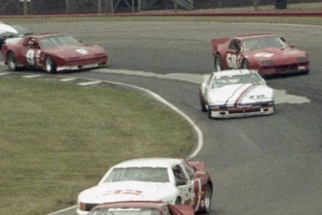 Bruce Jenner's striped #72 Pontiac in a Trans-Am pack, among Camaros and Firebirds