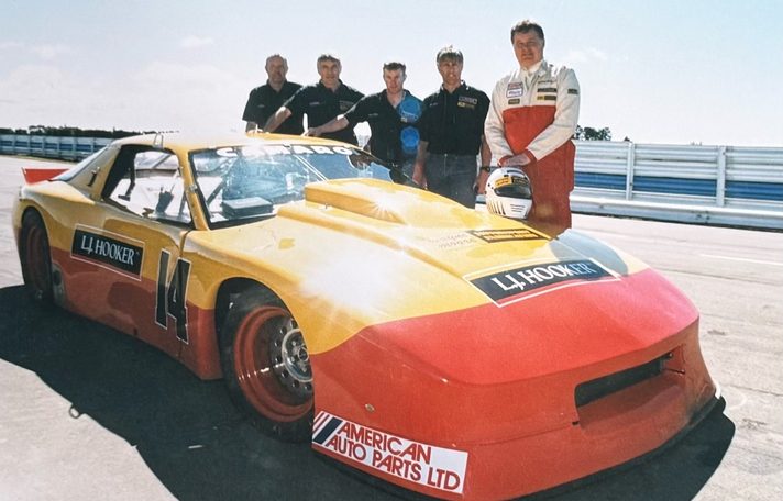 Lindsay Dodd's #14 L.J. Hooker Camaro replica with its driver and crew in the pit lane