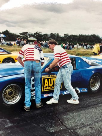 Bruce Jenner at the door of the blue #8 Pontiac as Scott Lagasse gets in at Wigram